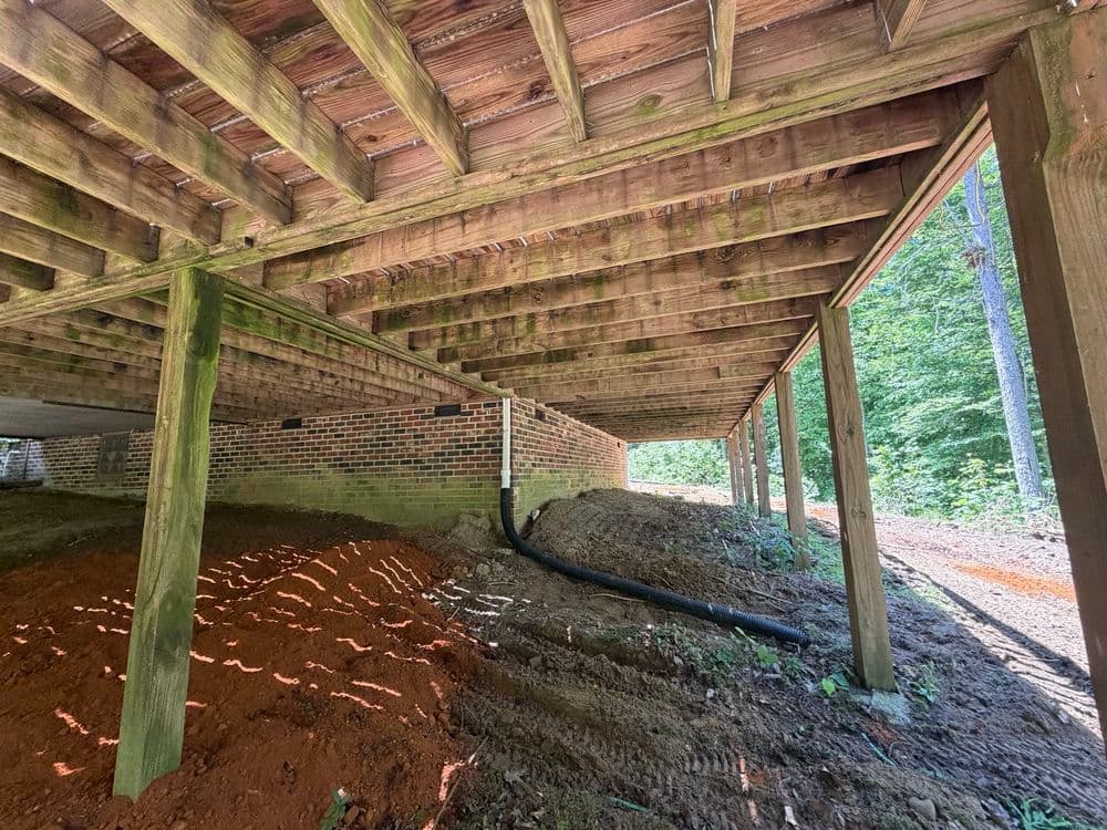 Gallery photos for Roof Drain Gutter Lead and Erosion Fix on a Hillside Home in Mechanicsville: Image #1