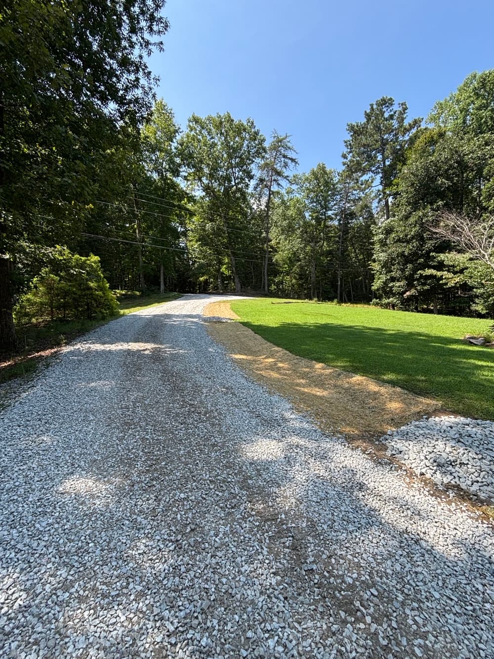 Gallery photos for Driveway Drainage Fix with Swale, Check Dams and New Gravel in West Point: Image #1