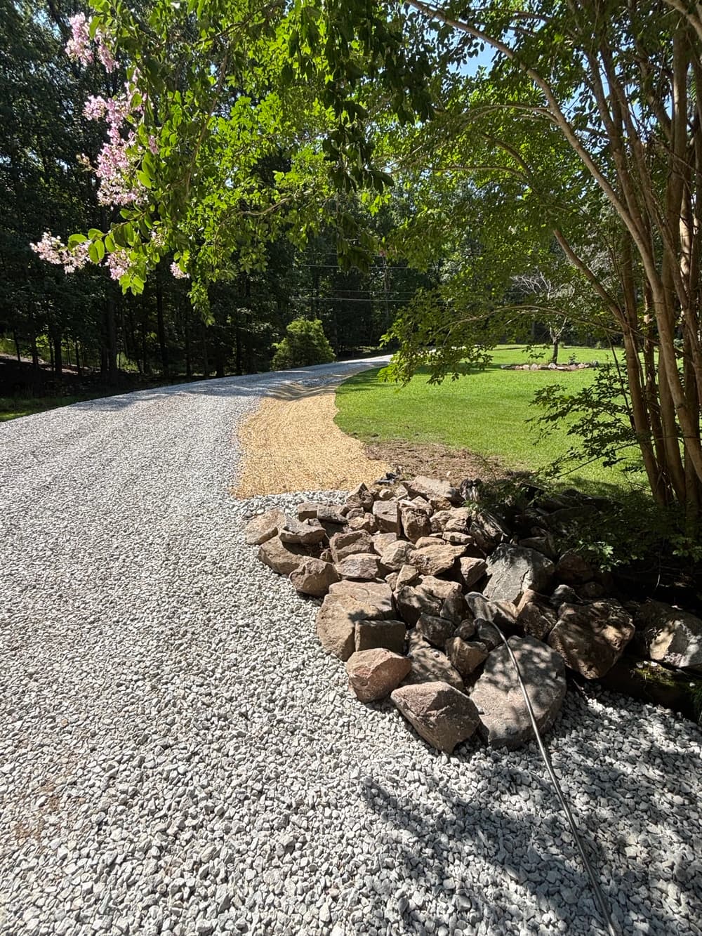 Driveway Drainage Fix with Swale, Check Dams and New Gravel in West Point image
