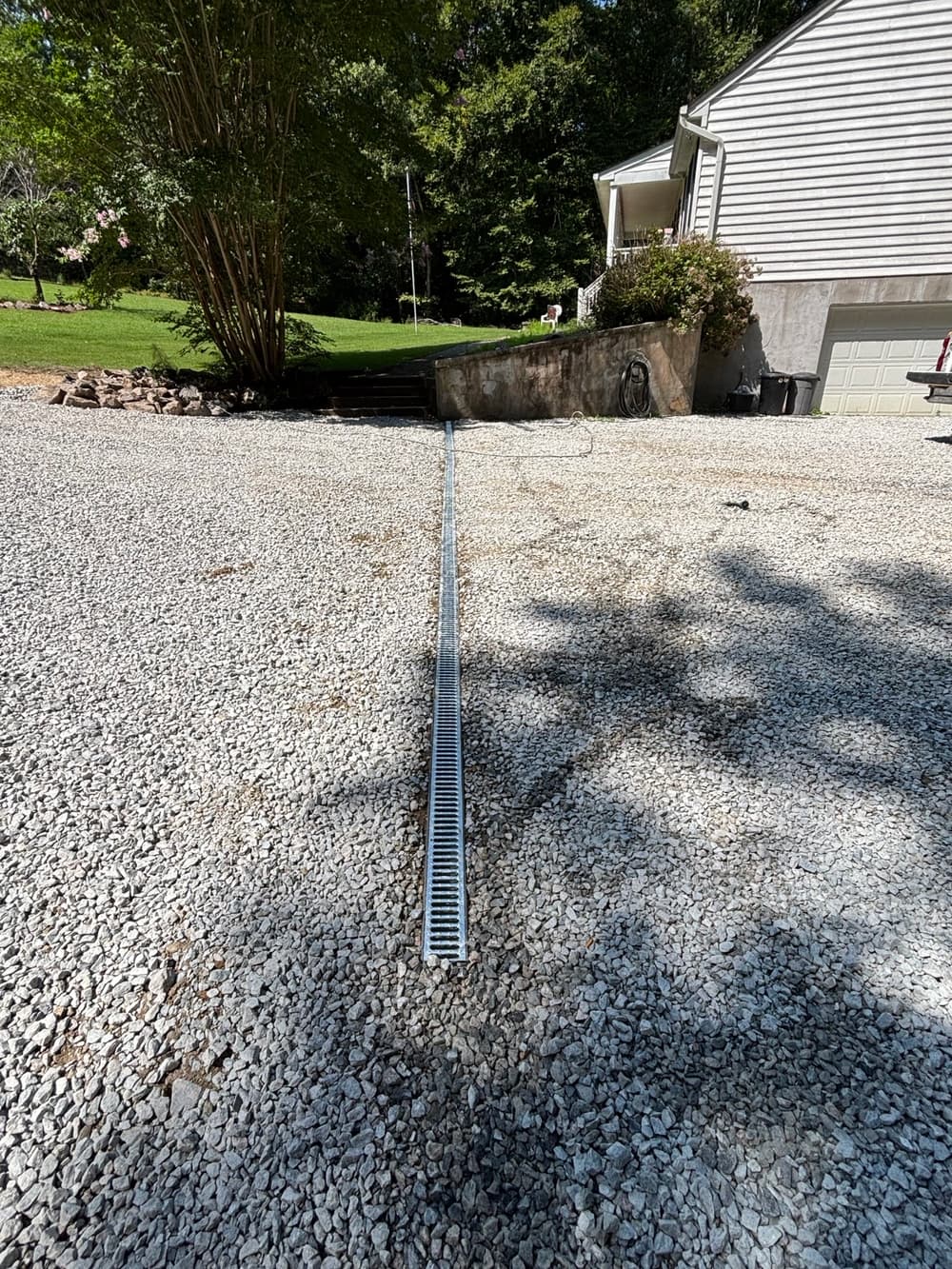 Gallery photos for Driveway Drainage Fix with Swale, Check Dams and New Gravel in West Point: Image #2